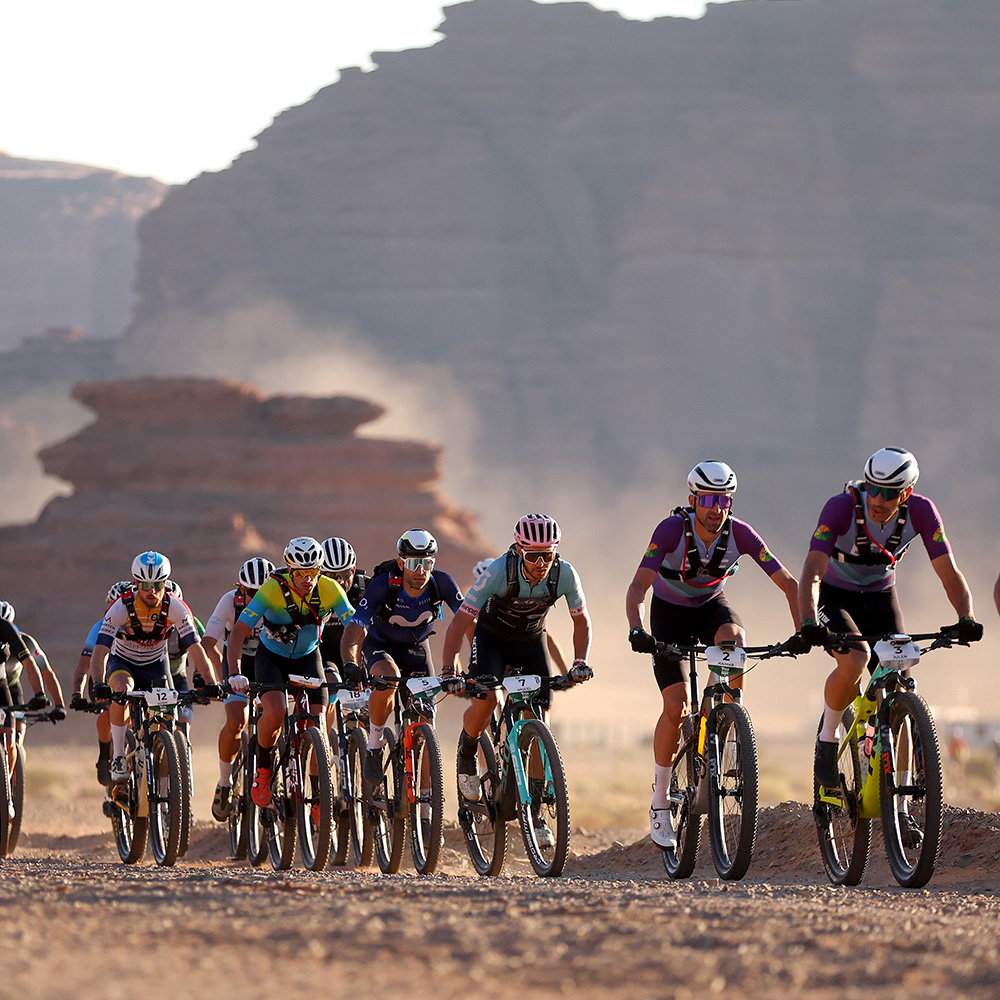 A group of mountain bikers competing in a mountain bike race in NEOM's titan desert